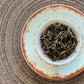 Teacup full of gold-tipped black tea