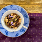 teacup full of spices, coffee beans and purple mermaid tail sprinkles