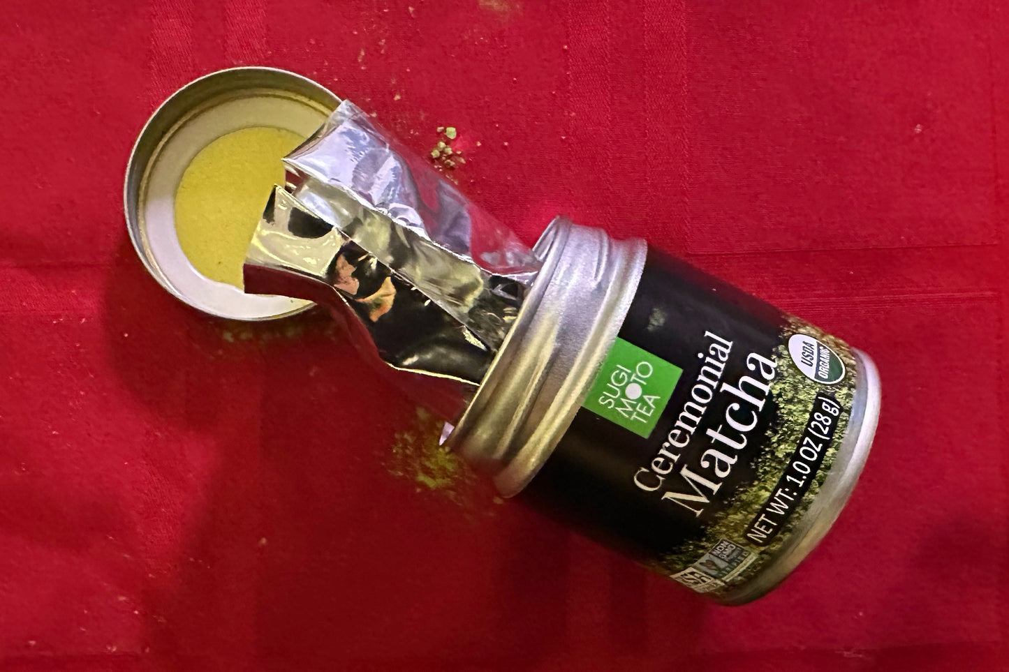 An open tin of ceremonial matcha